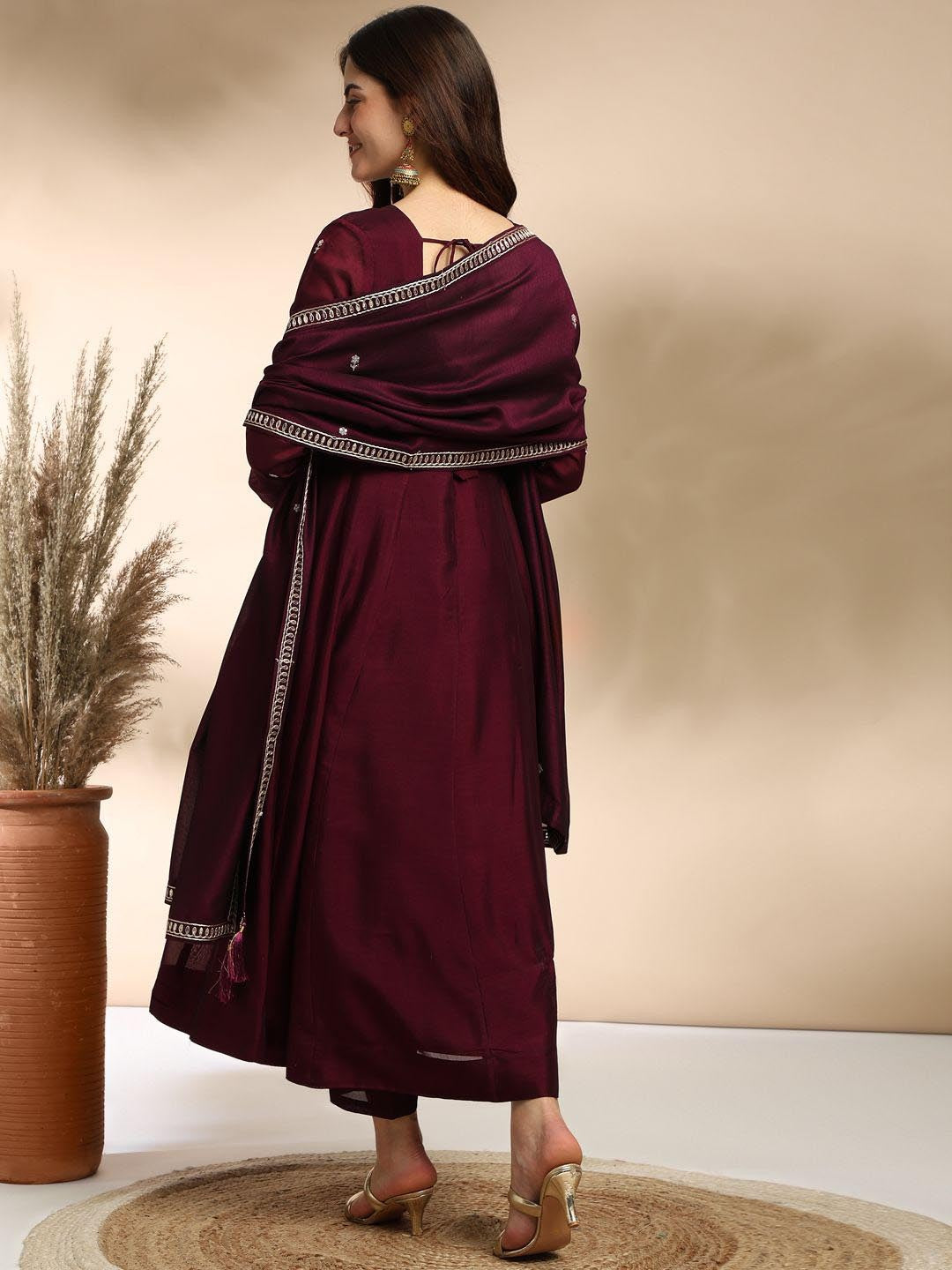 Elevate your wardrobe with this elegant maroon kurti set, adorned with delicate embroidery and a graceful silhouette