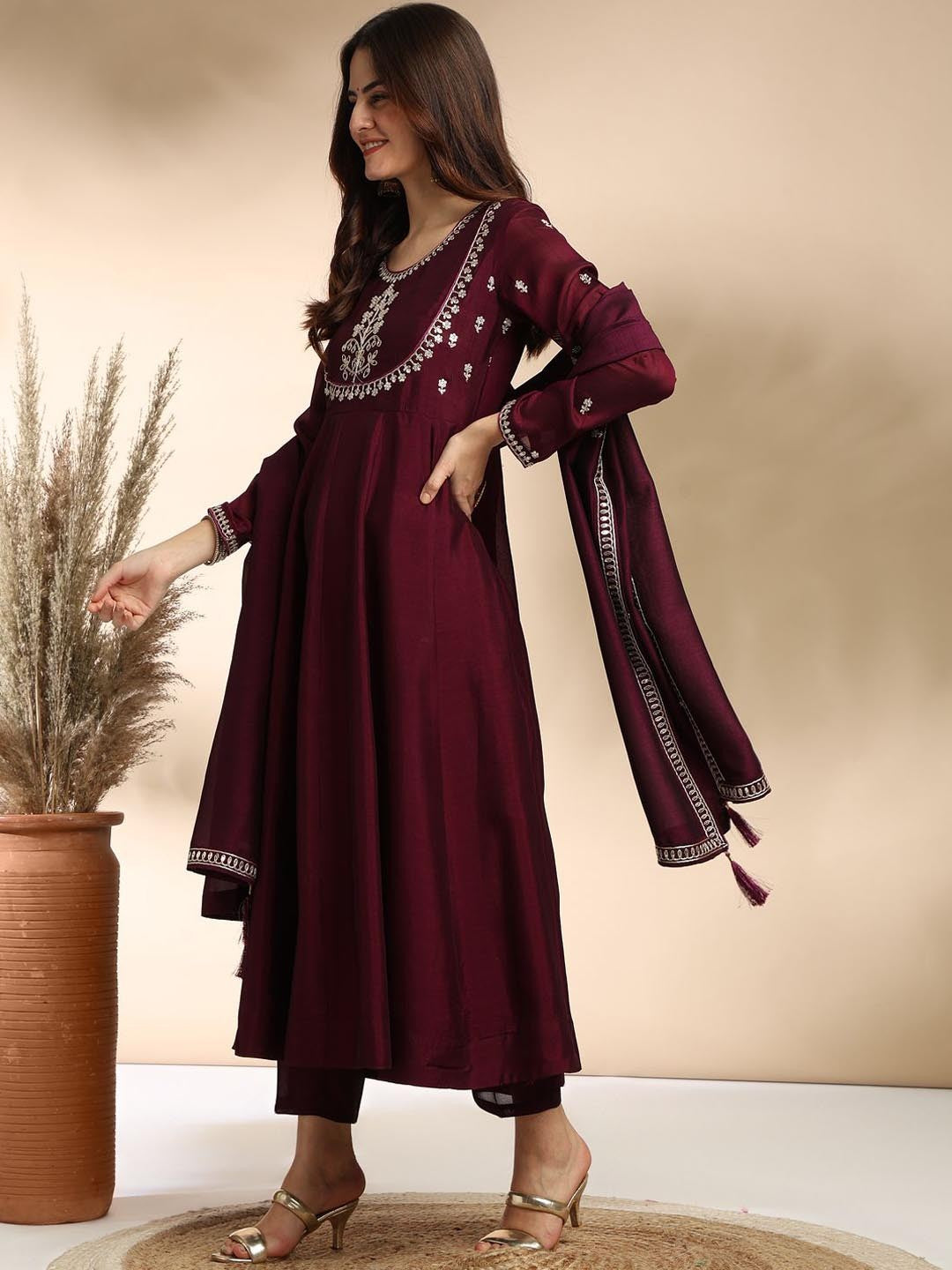 Elevate your wardrobe with this elegant maroon kurti set, adorned with delicate embroidery and a graceful silhouette