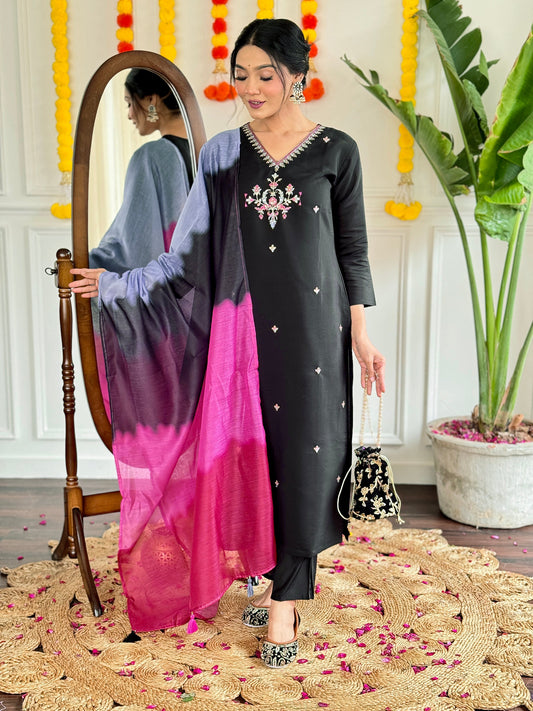 Make a bold statement with this stunning black kurti set, featuring intricate embroidery and a striking ombre dupatta in shades of pink and grey