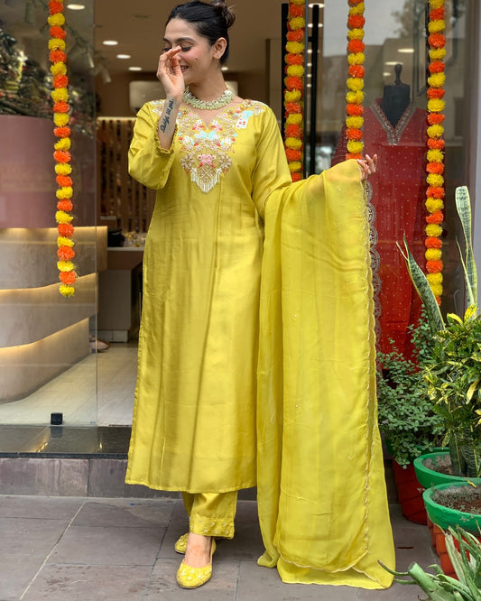 Radiate elegance in this vibrant yellow kurti set, adorned with delicate embroidery and paired with a graceful dupatta