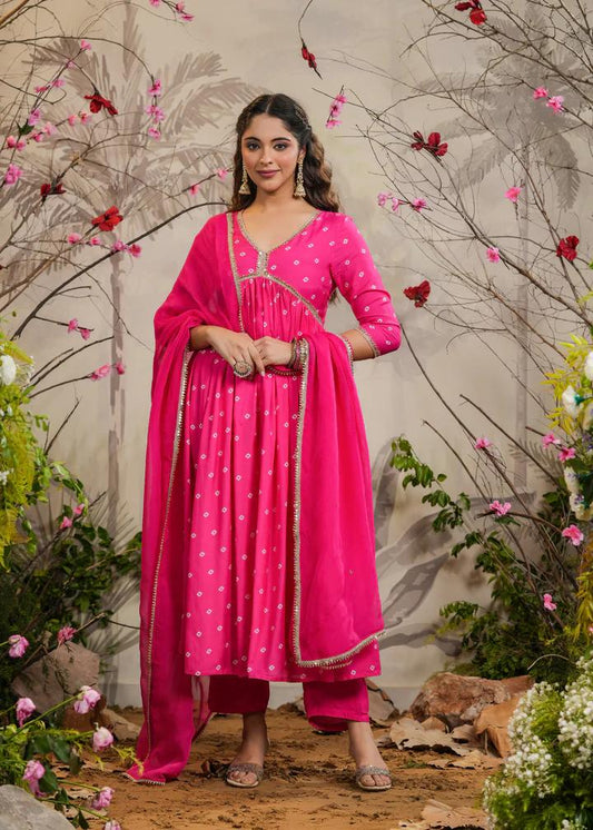 Turn heads in this stunning pink kurti set, featuring delicate mirror work and intricate detailing. Paired with a flowy dupatta and comfortable bottoms