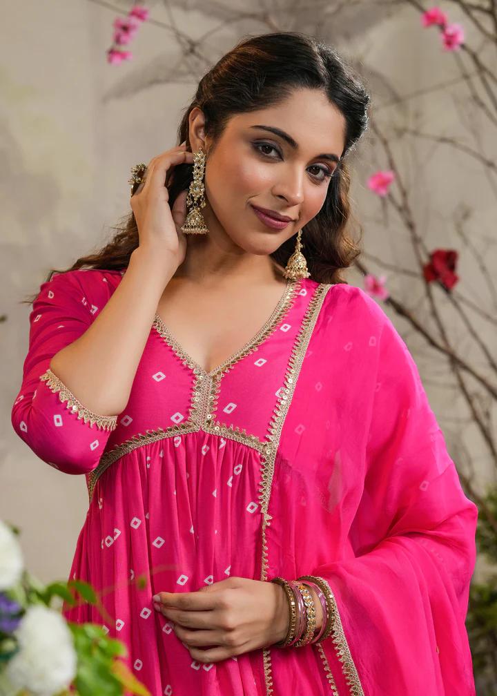 Turn heads in this stunning pink kurti set, featuring delicate mirror work and intricate detailing. Paired with a flowy dupatta and comfortable bottoms