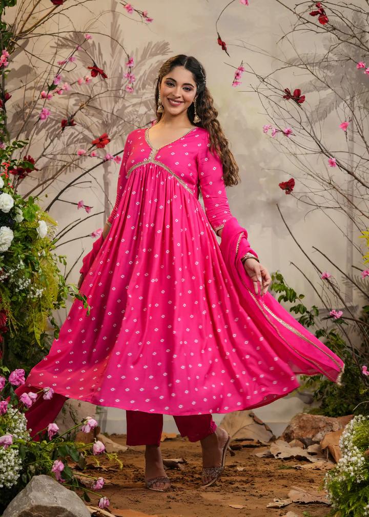 Turn heads in this stunning pink kurti set, featuring delicate mirror work and intricate detailing. Paired with a flowy dupatta and comfortable bottoms