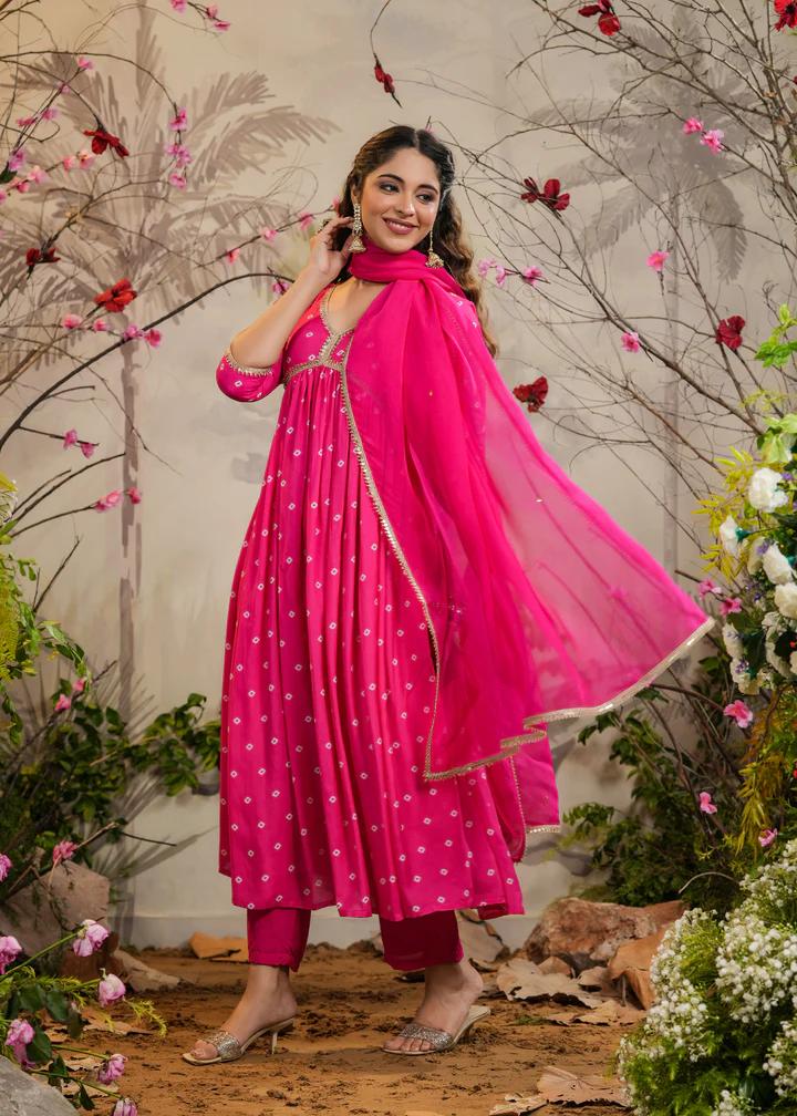 Turn heads in this stunning pink kurti set, featuring delicate mirror work and intricate detailing. Paired with a flowy dupatta and comfortable bottoms