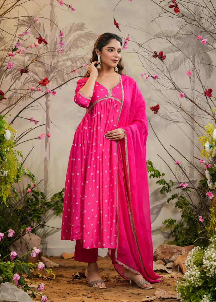 Turn heads in this stunning pink kurti set, featuring delicate mirror work and intricate detailing. Paired with a flowy dupatta and comfortable bottoms