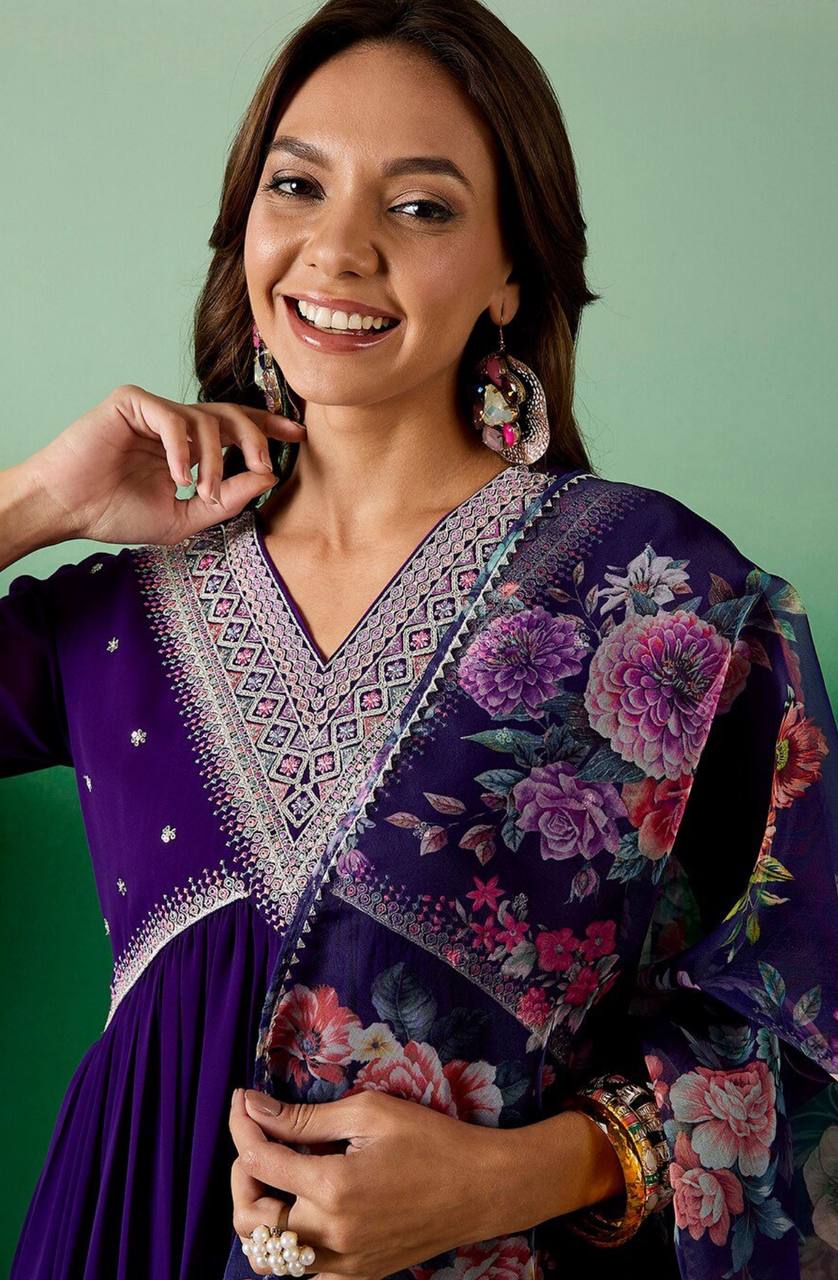 Elevate your style with this stunning deep purple Anarkali kurti set. Featuring intricate embroidery, delicate mirror work