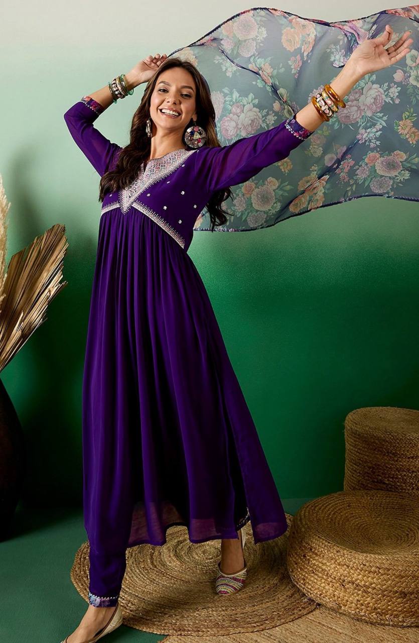 Elevate your style with this stunning deep purple Anarkali kurti set. Featuring intricate embroidery, delicate mirror work