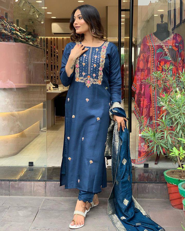 Make a statement with this stunning navy blue kurti set, featuring intricate embroidery and a gracefully adorned dupatta