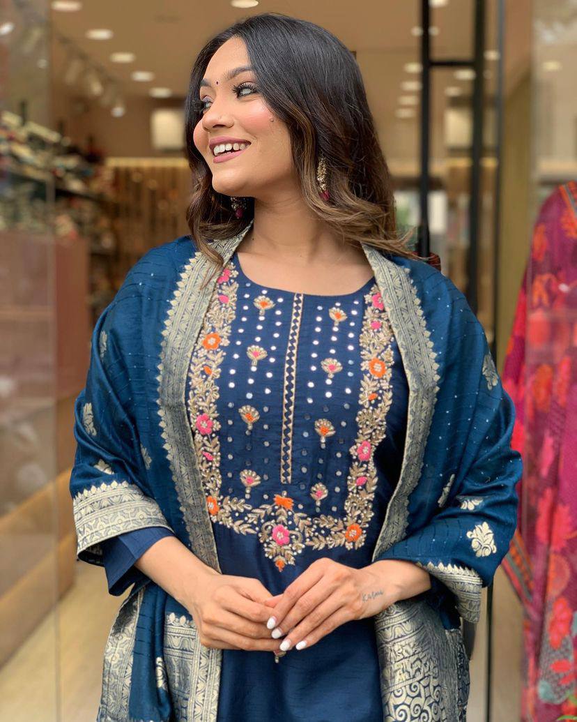 Make a statement with this stunning navy blue kurti set, featuring intricate embroidery and a gracefully adorned dupatta