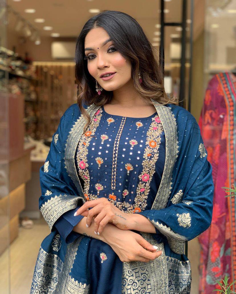Make a statement with this stunning navy blue kurti set, featuring intricate embroidery and a gracefully adorned dupatta