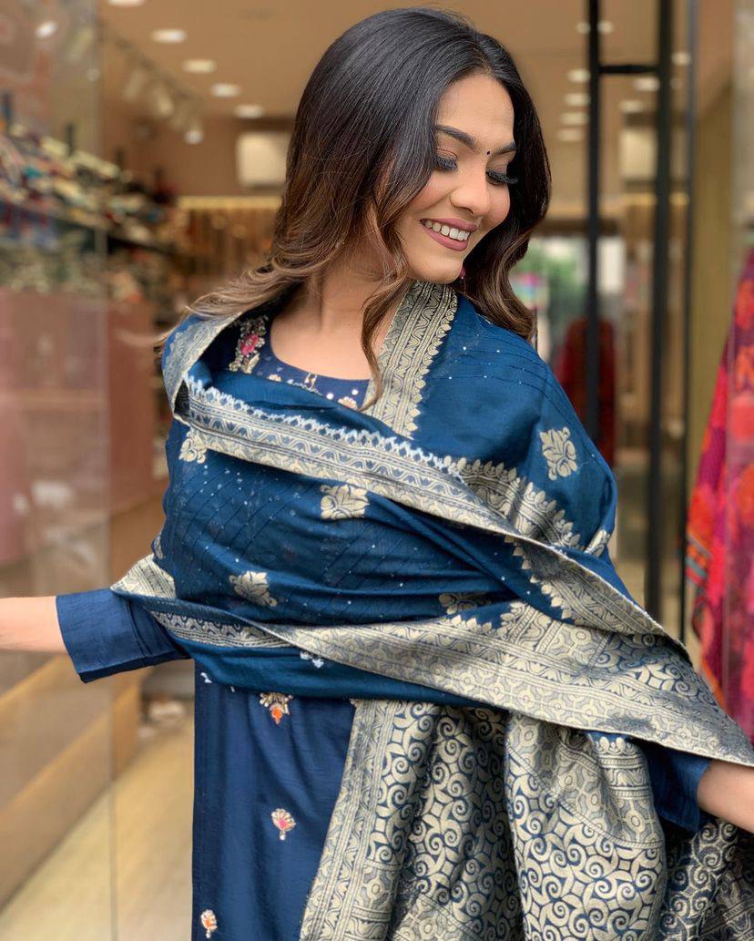 Make a statement with this stunning navy blue kurti set, featuring intricate embroidery and a gracefully adorned dupatta