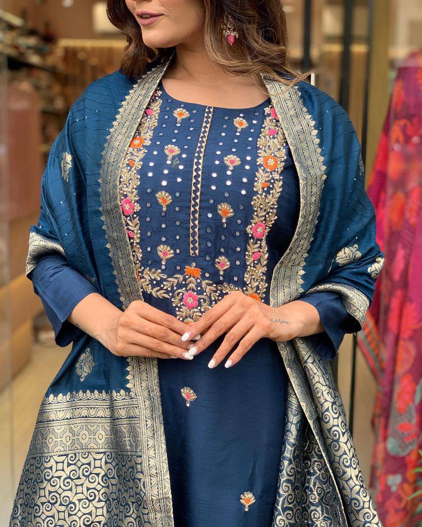 Make a statement with this stunning navy blue kurti set, featuring intricate embroidery and a gracefully adorned dupatta