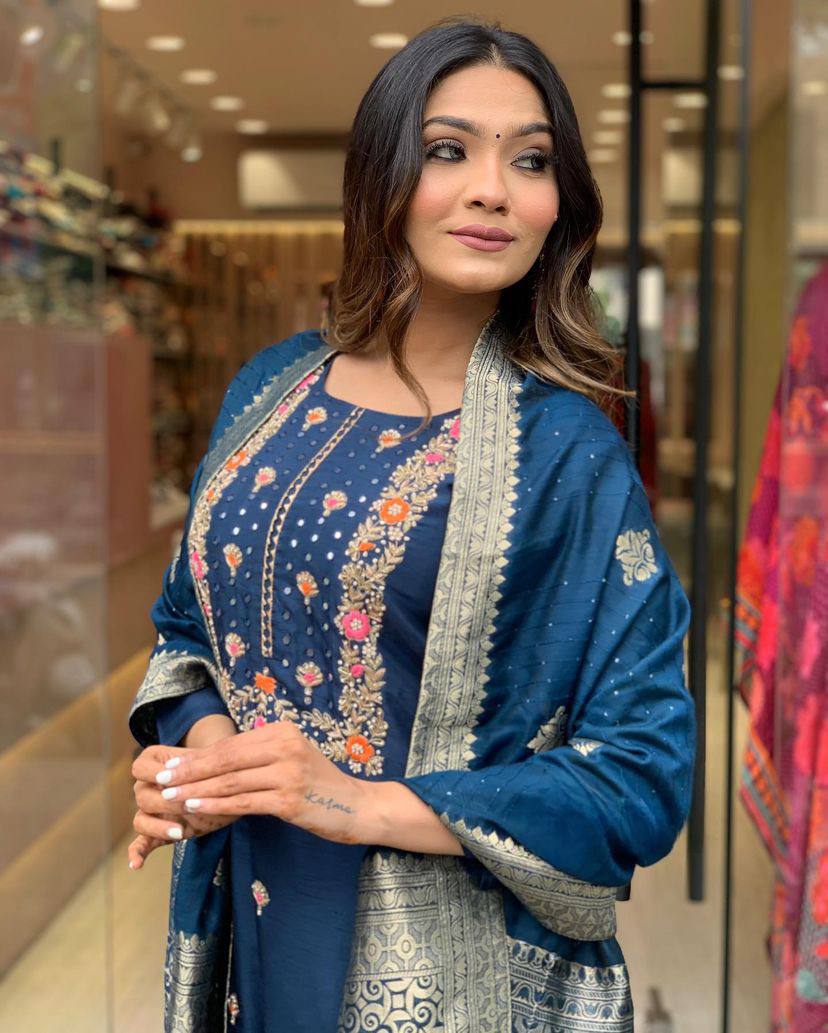 Make a statement with this stunning navy blue kurti set, featuring intricate embroidery and a gracefully adorned dupatta