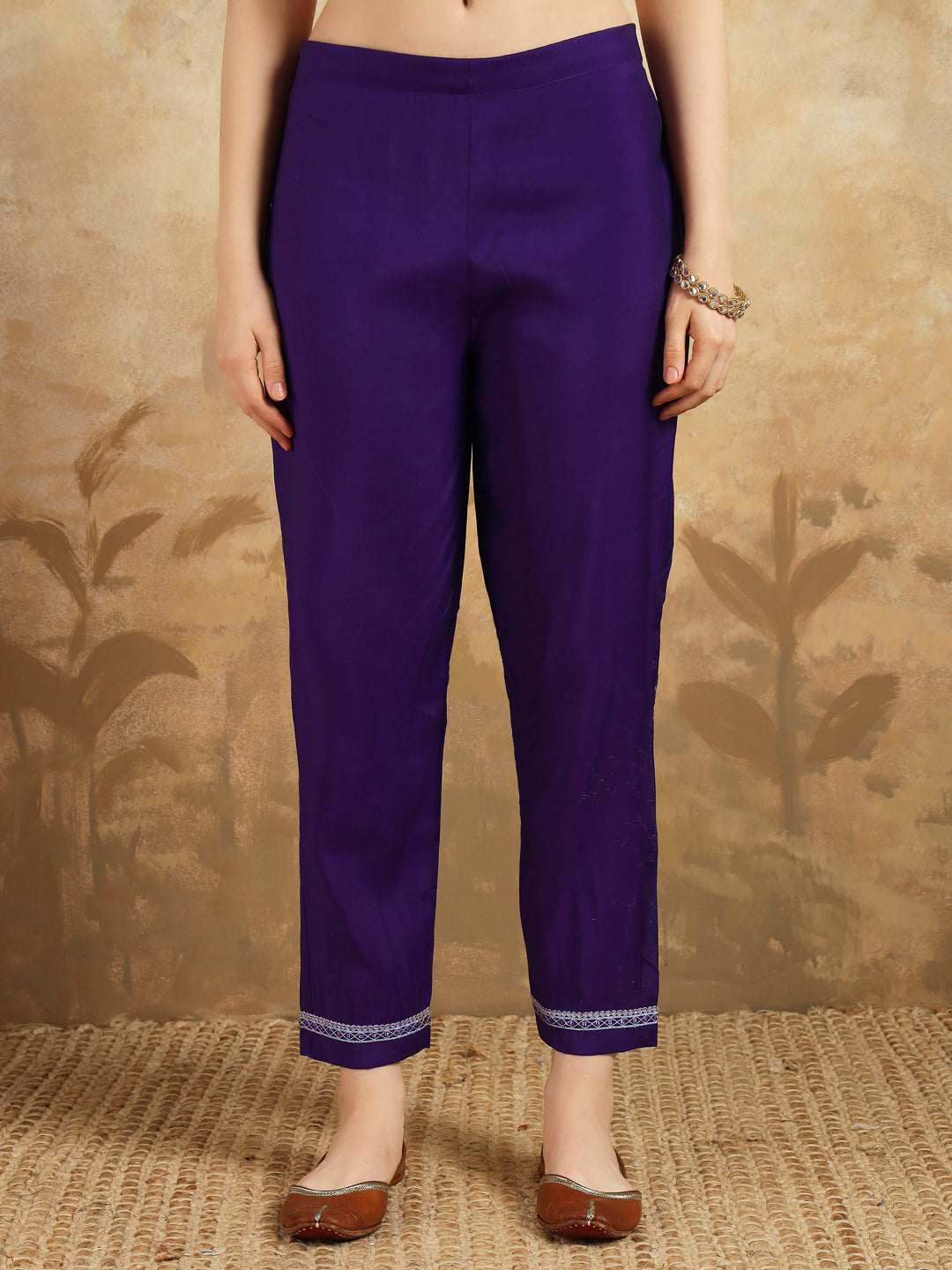 Embrace elegance with this regal purple kurti set, adorned with intricate embroidery and paired with a beautifully striped and embroidered dupatta