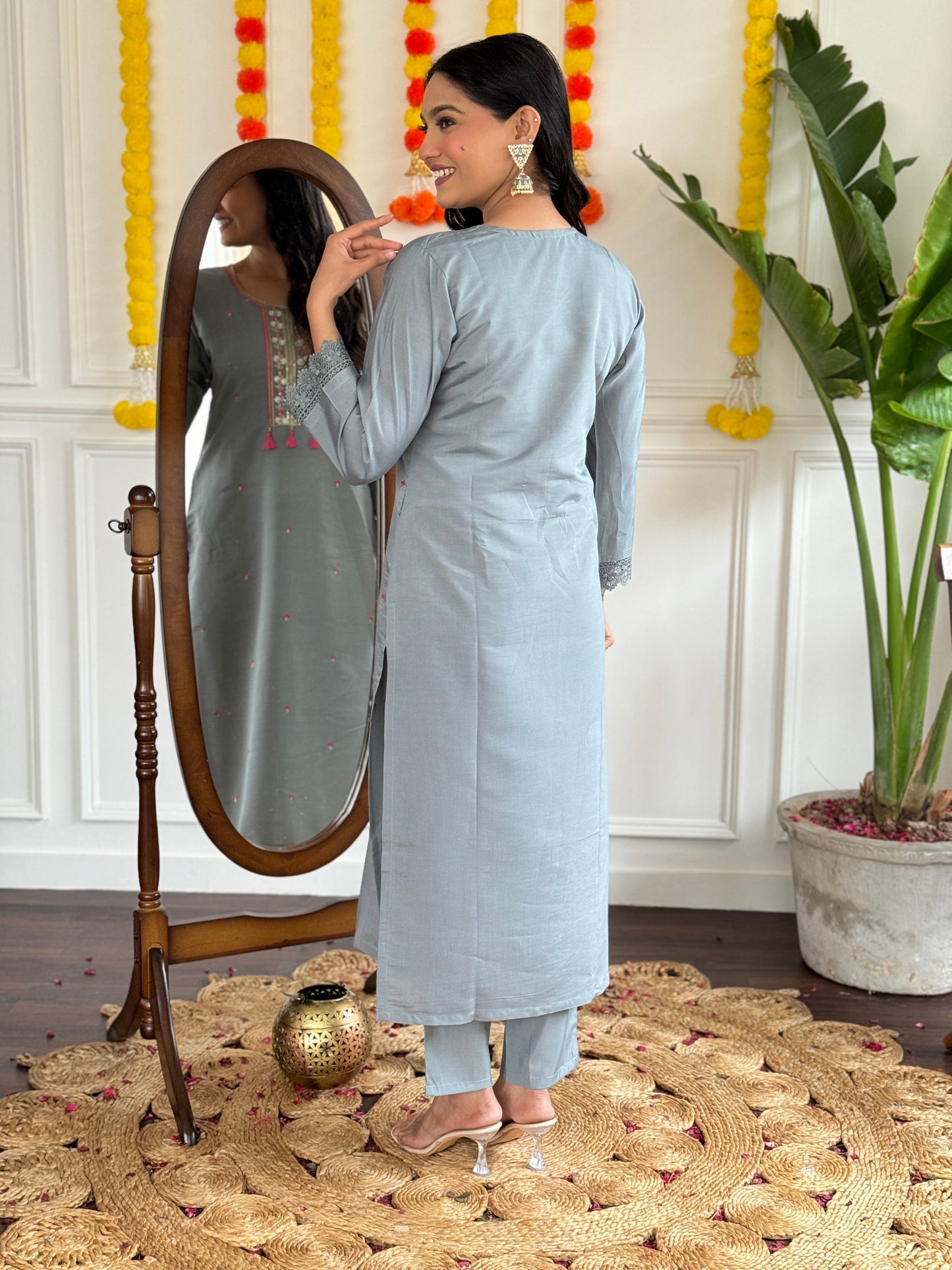 Elevate your style with this elegant grey kurti set, adorned with delicate embroidery and a vibrant pink dupatta