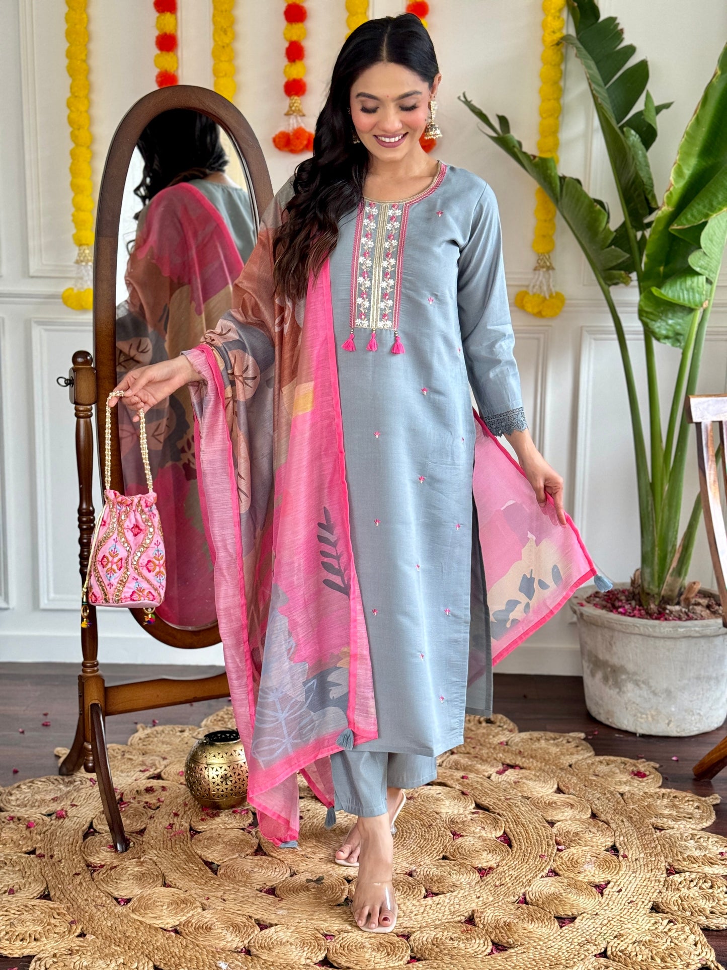 Elevate your style with this elegant grey kurti set, adorned with delicate embroidery and a vibrant pink dupatta