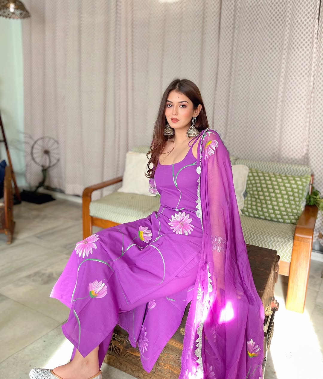 Radiate charm with this vibrant purple kurti set, beautifully adorned with delicate floral prints. The flowy silhouette, paired with a matching dupatta