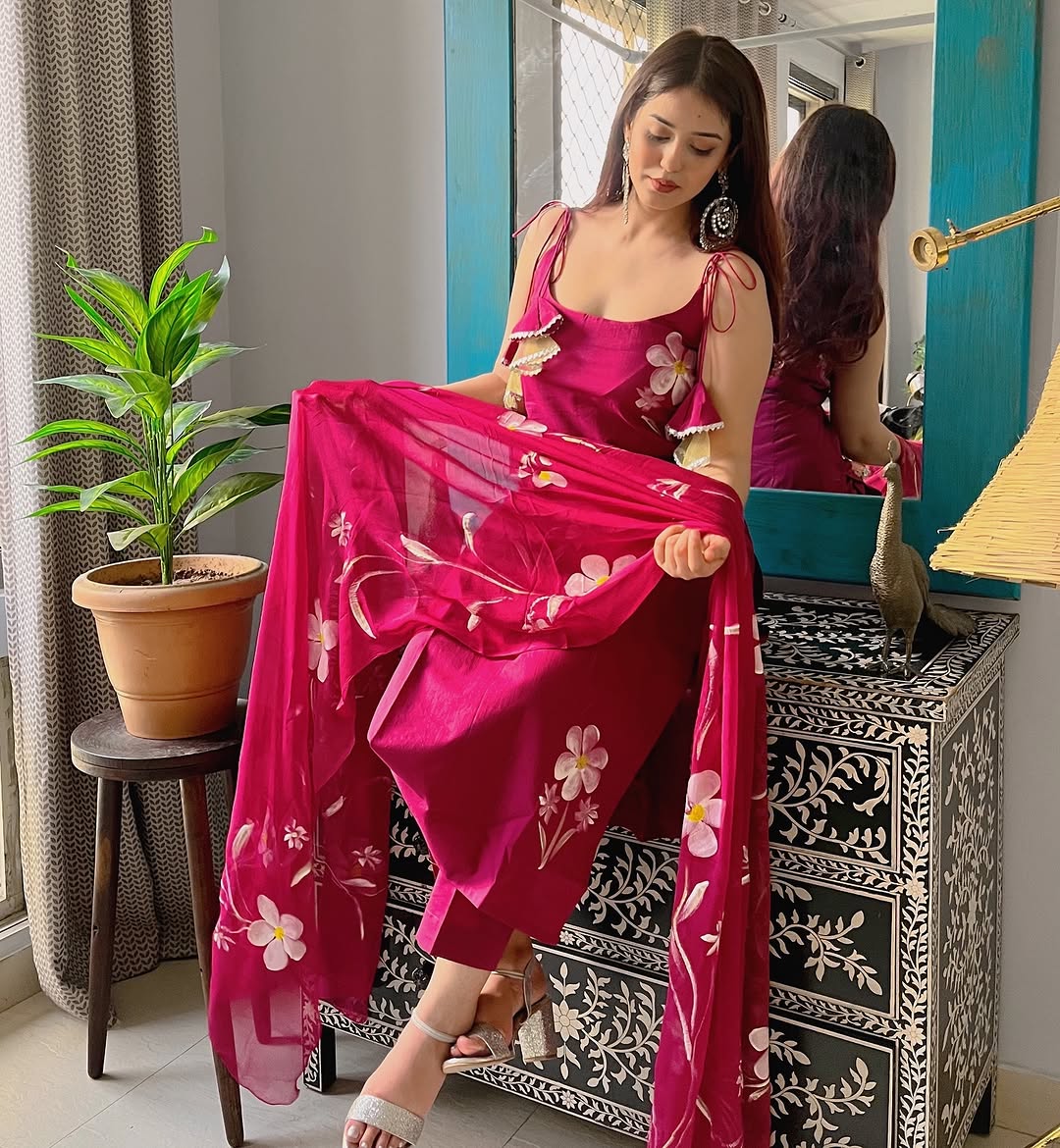 Radiate charm with this vibrant purple kurti set, beautifully adorned with delicate floral prints. The flowy silhouette, paired with a matching dupatta
