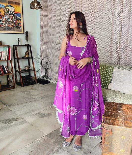 Radiate charm with this vibrant purple kurti set, beautifully adorned with delicate floral prints. The flowy silhouette, paired with a matching dupatta