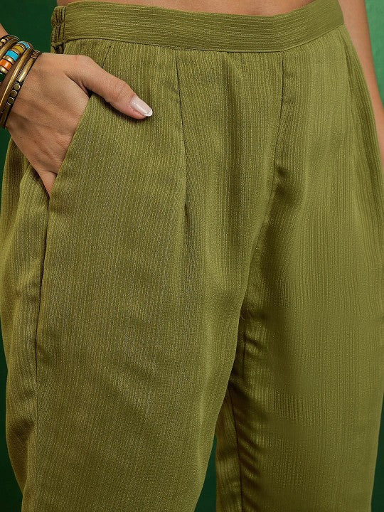 Flowy and elegant, this olive-green kurti set is a blend of comfort and style. Designed with delicate embroidery and paired with a lightweight dupatta