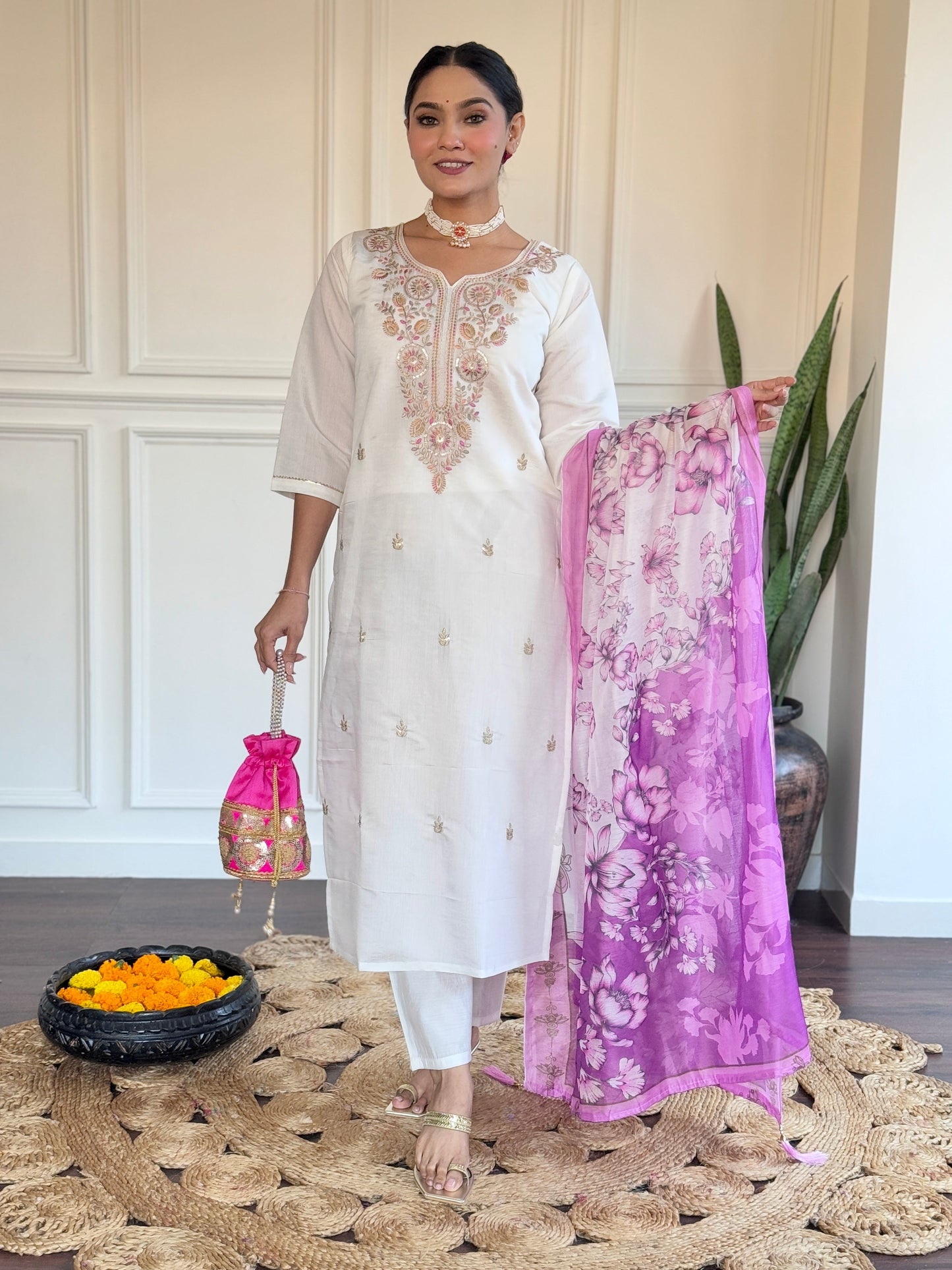 Embrace elegance with this serene white kurti set, adorned with delicate pastel embroidery and a floral-printed blue dupatta