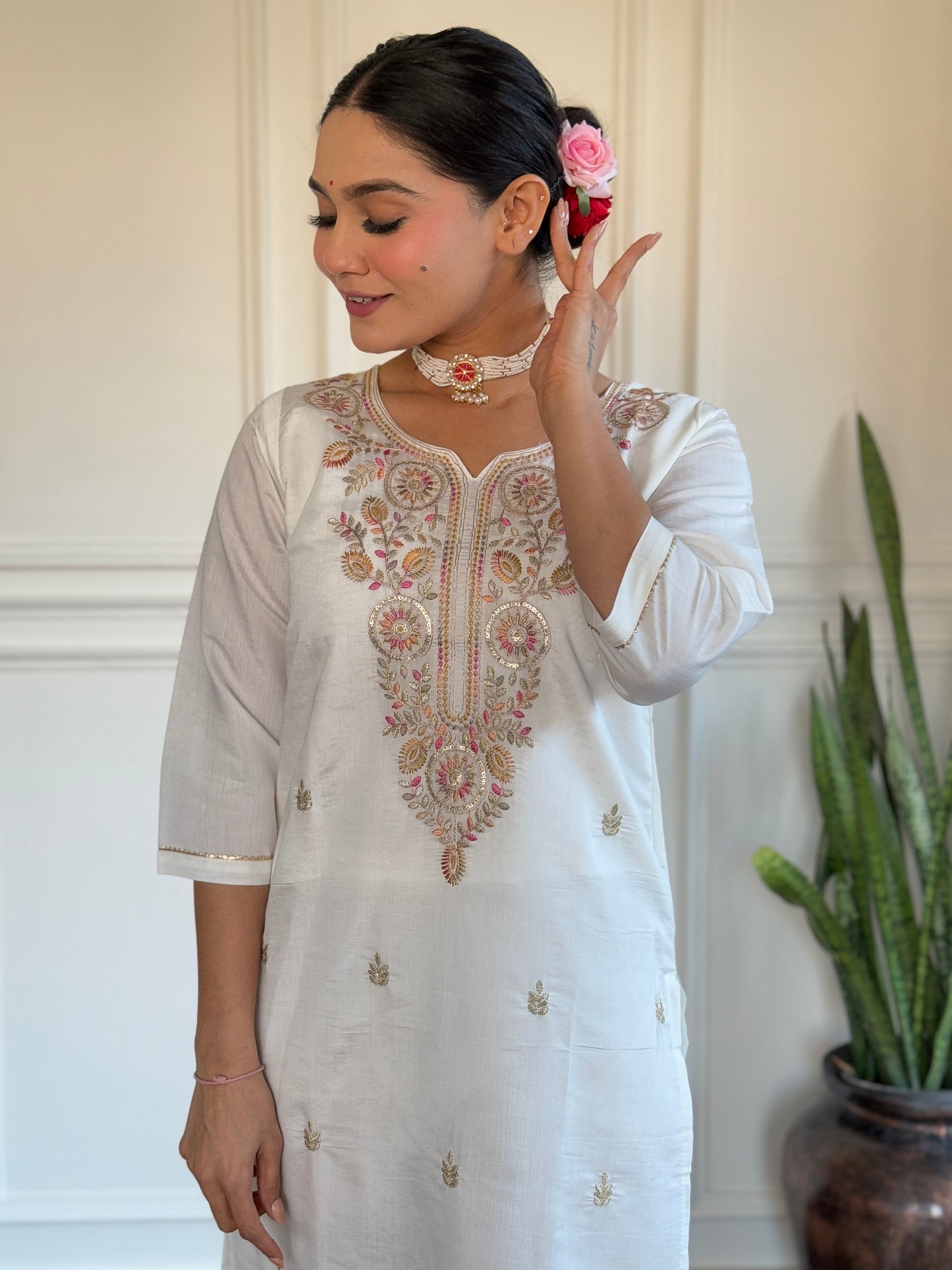 Embrace elegance with this serene white kurti set, adorned with delicate pastel embroidery and a floral-printed blue dupatta