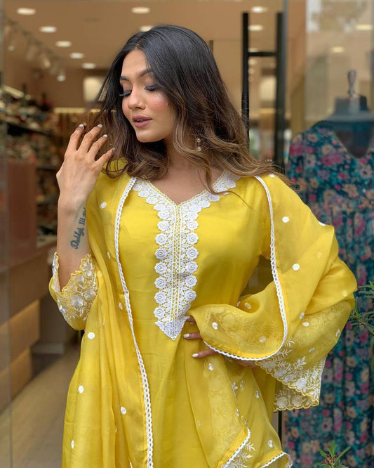 Radiate elegance in this vibrant yellow kurti set, adorned with delicate white embroidery and a beautifully crafted dupatta