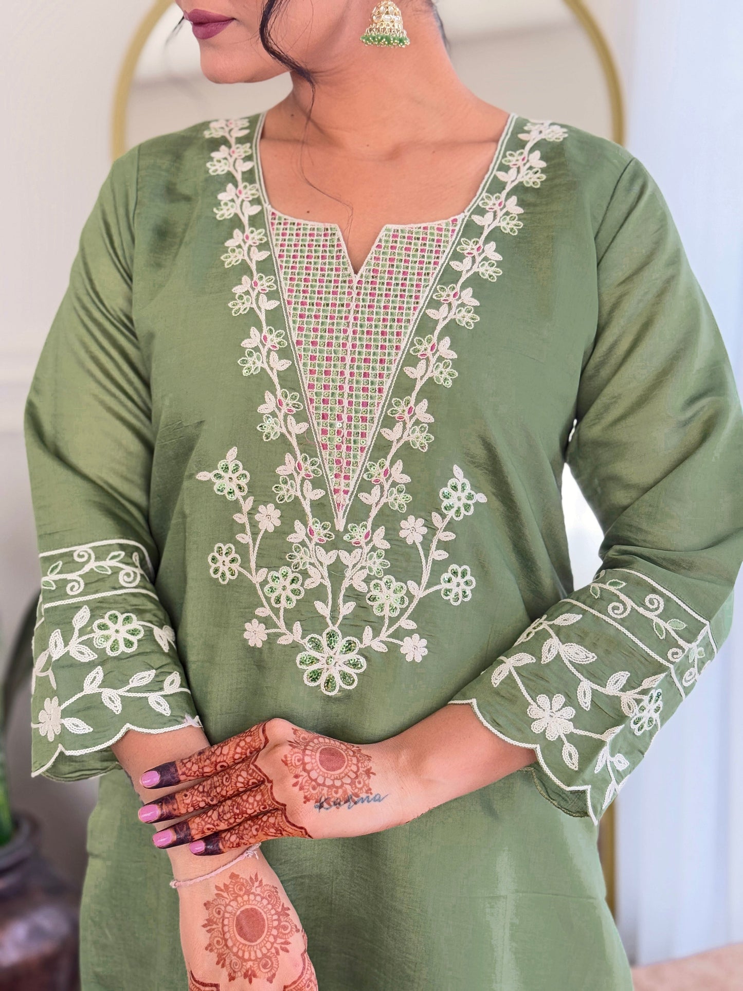 Embrace elegance with this sage green kurti set, beautifully adorned with delicate white embroidery. The soft fabric and intricate detailing make it perfect for any occasion