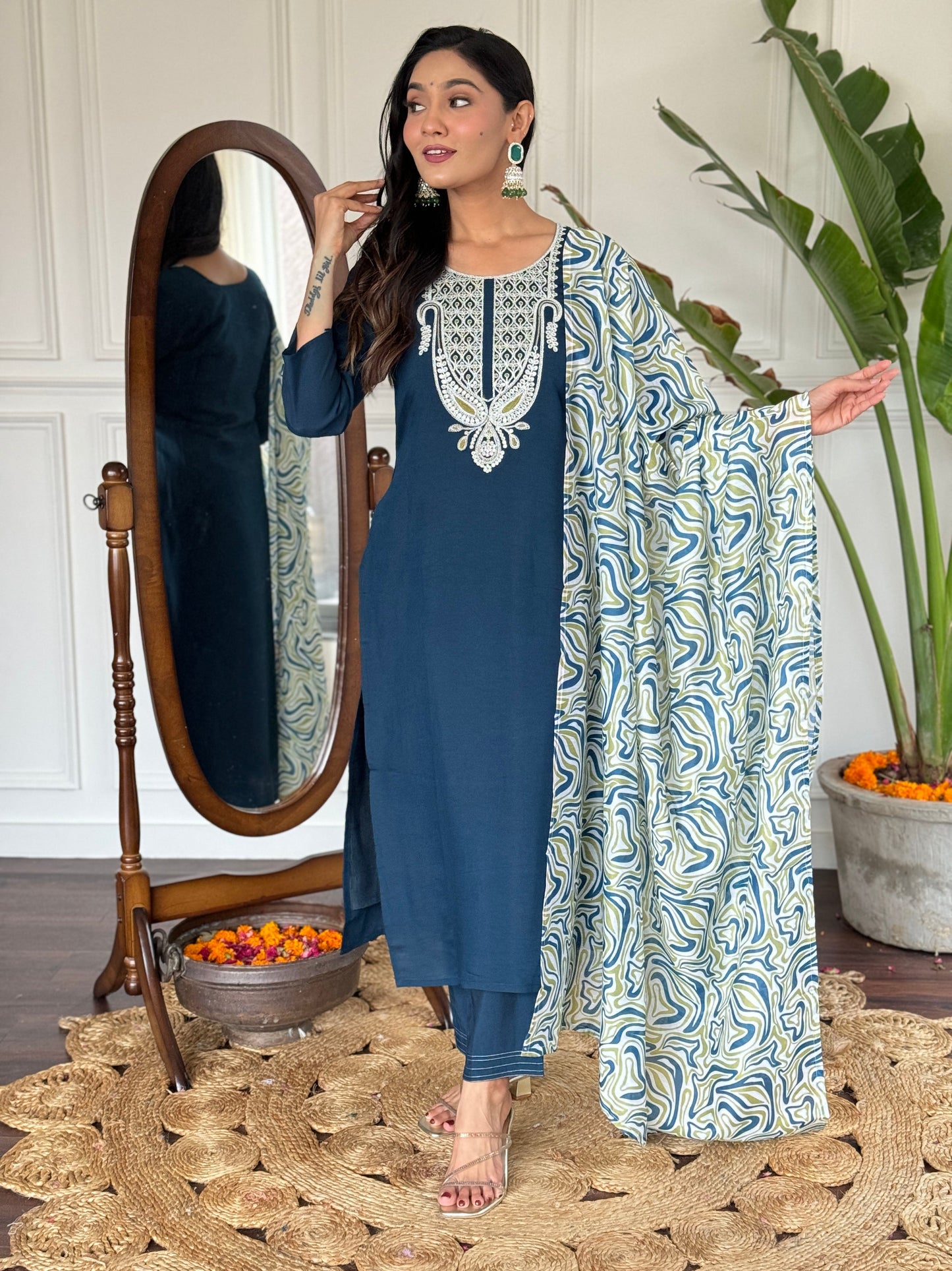 Elevate your style with this sophisticated navy blue kurti set, featuring intricate white embroidery on the neckline