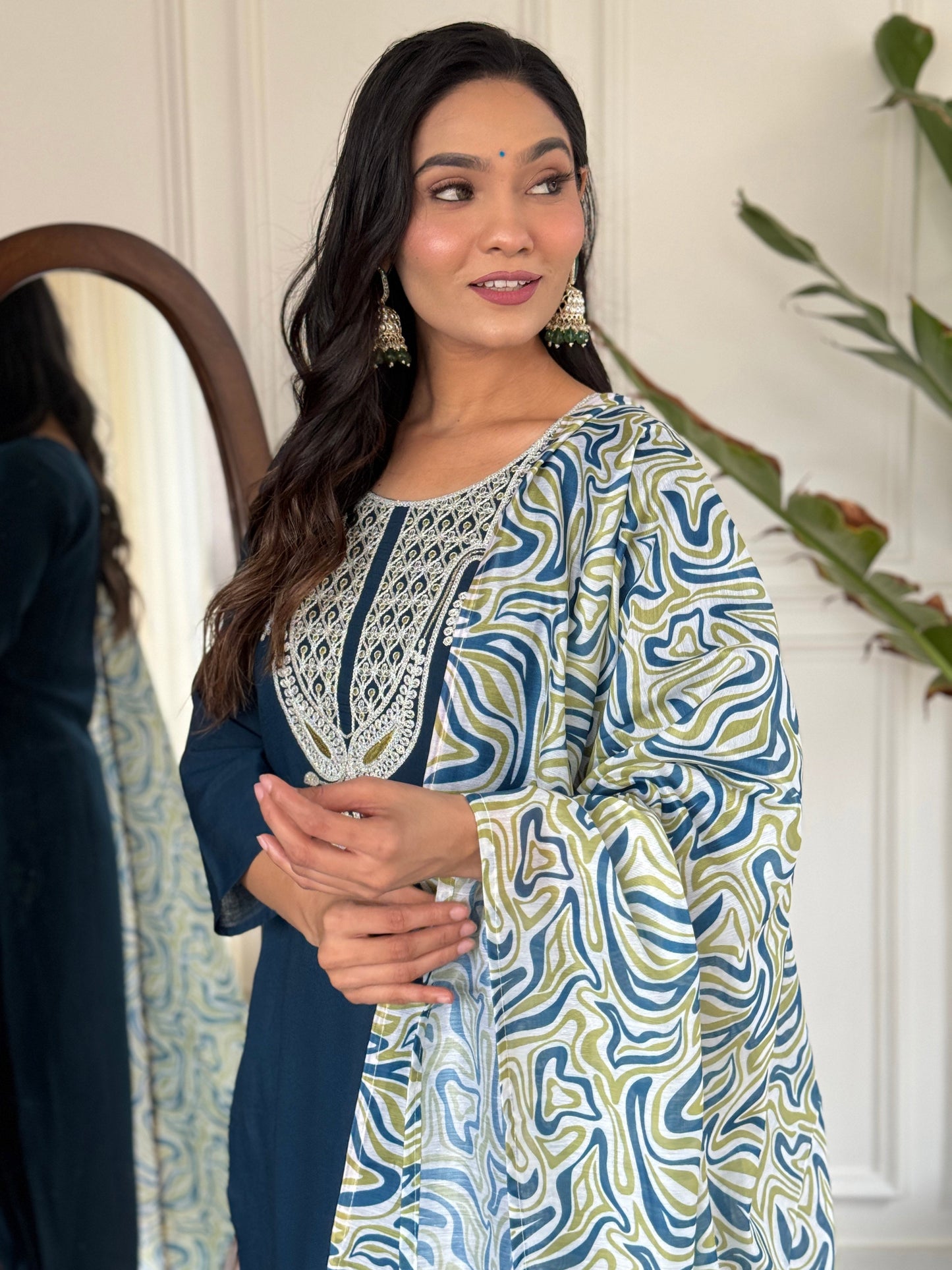 Elevate your style with this sophisticated navy blue kurti set, featuring intricate white embroidery on the neckline