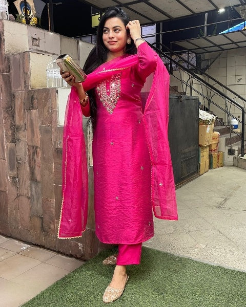 Drape yourself in elegance with this vibrant pink kurti set, adorned with delicate embellishments and a stunning embroidered neckline