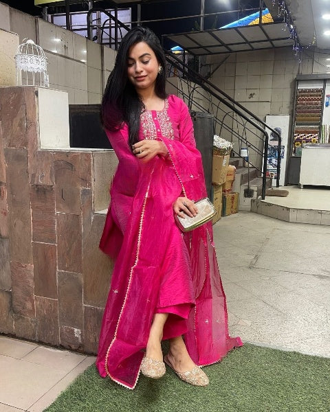 Drape yourself in elegance with this vibrant pink kurti set, adorned with delicate embellishments and a stunning embroidered neckline