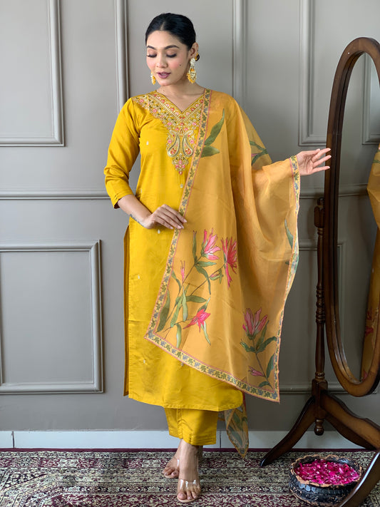 Elevate your style with this stunning mustard yellow kurti set, adorned with intricate embroidery and floral accents
