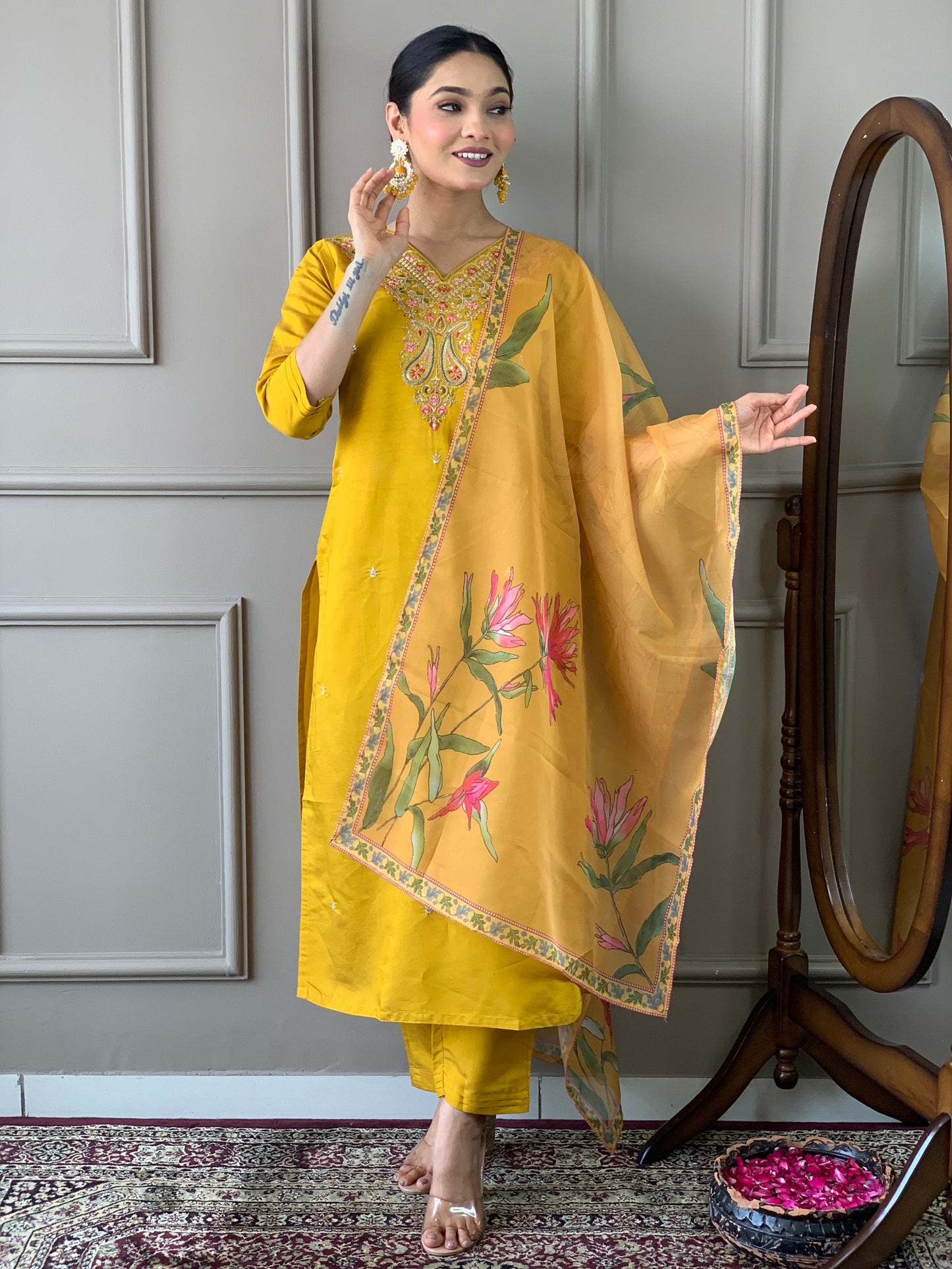Elevate your style with this stunning mustard yellow kurti set, adorned with intricate embroidery and floral accents