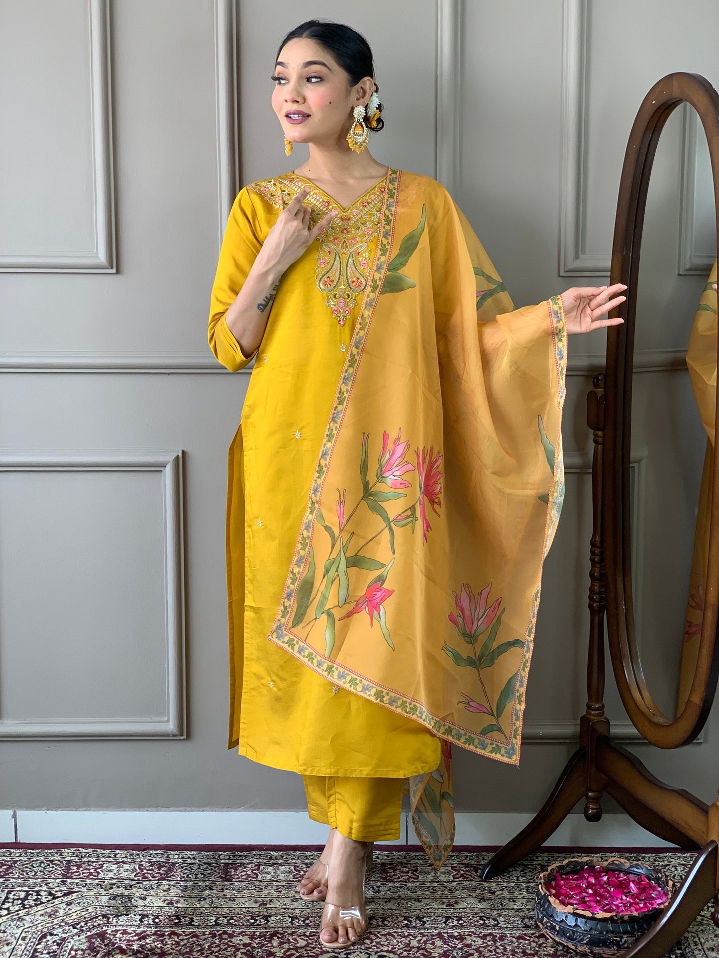 Elevate your style with this stunning mustard yellow kurti set, adorned with intricate embroidery and floral accents