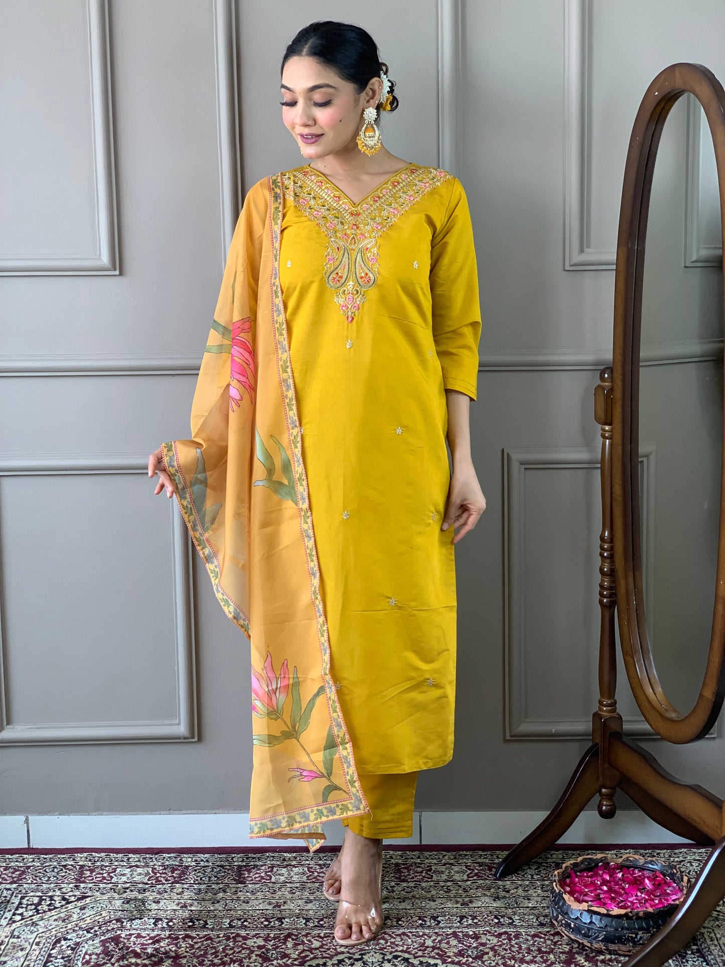 Elevate your style with this stunning mustard yellow kurti set, adorned with intricate embroidery and floral accents