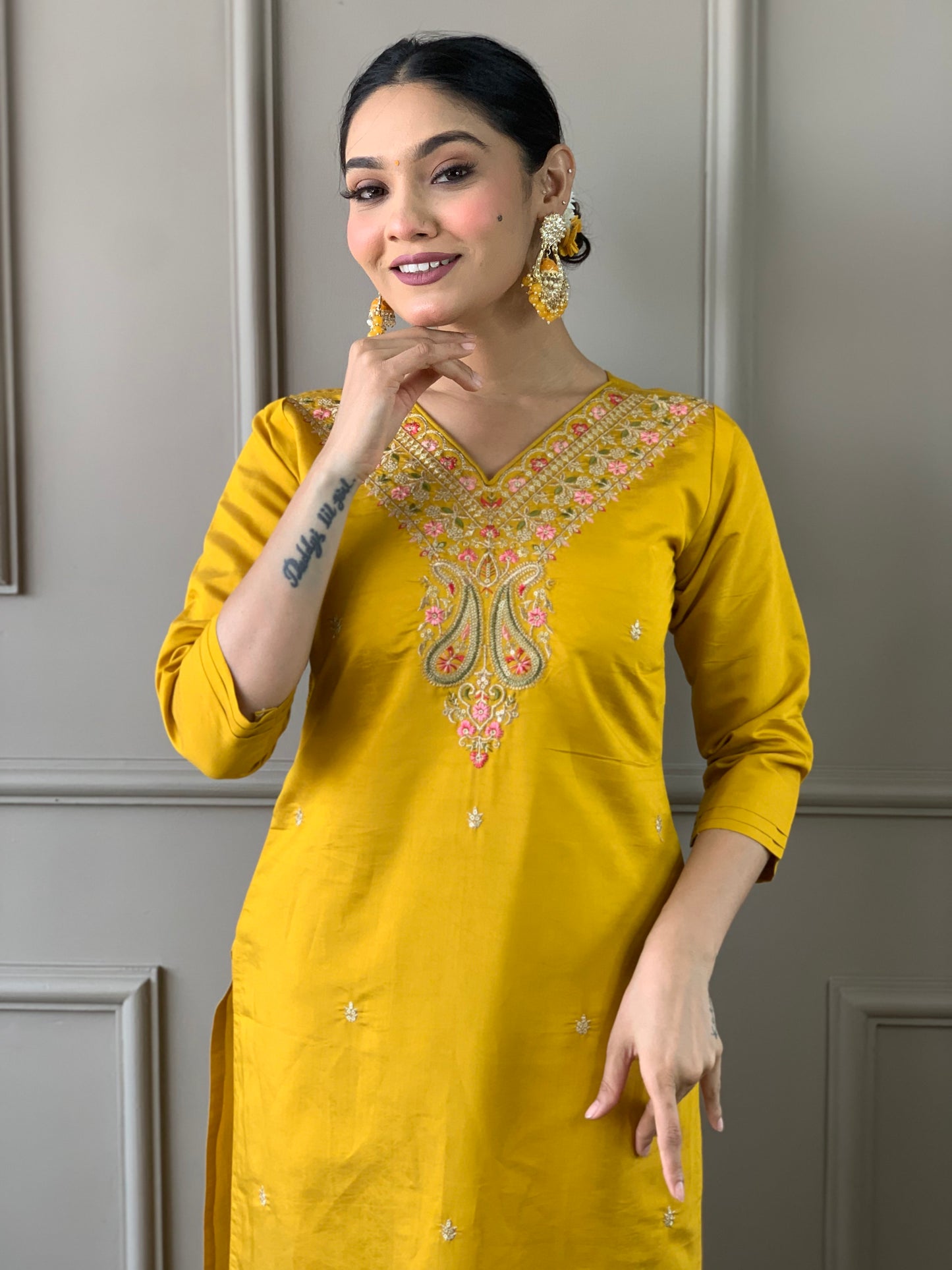 Elevate your style with this stunning mustard yellow kurti set, adorned with intricate embroidery and floral accents