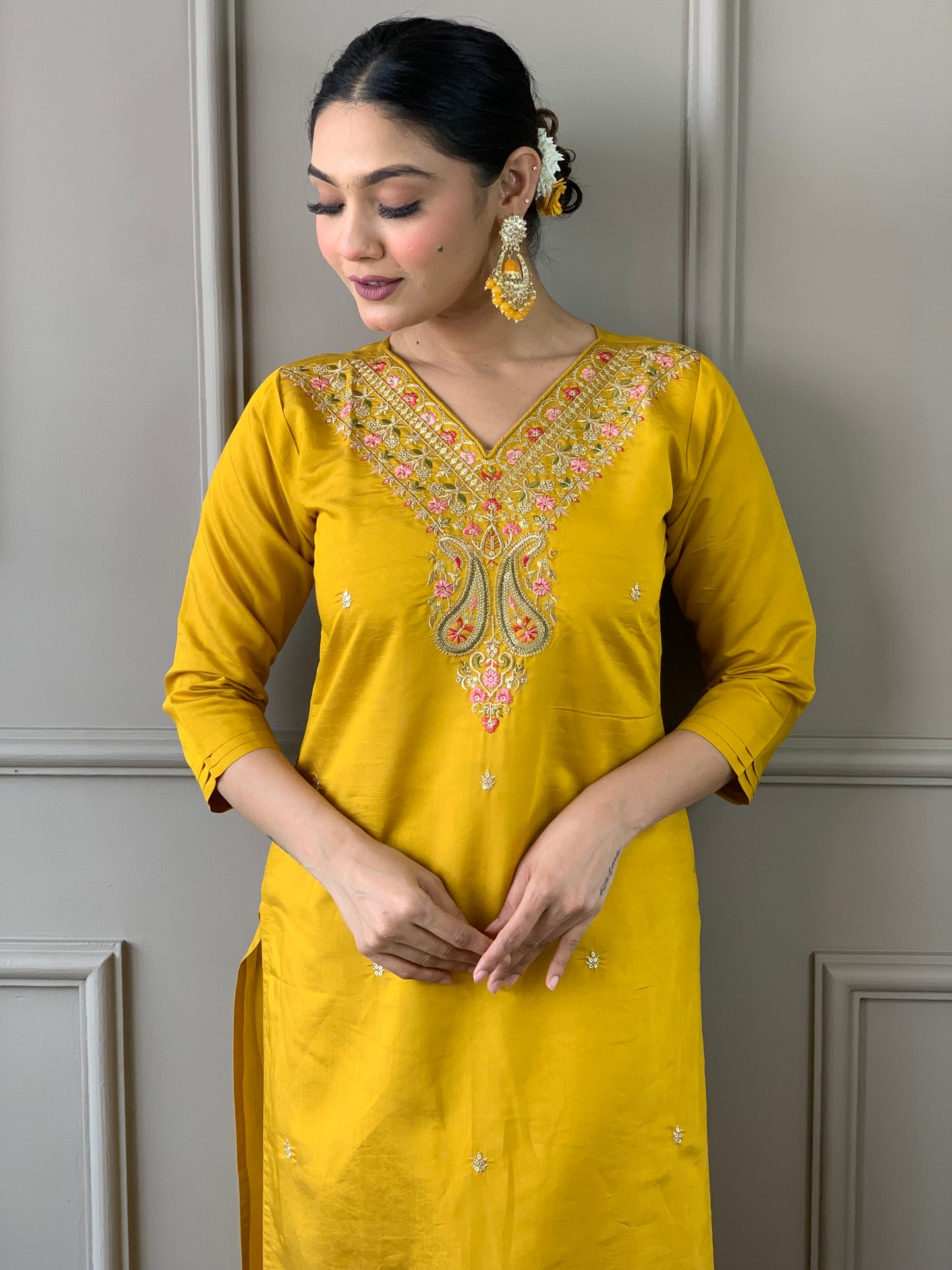 Elevate your style with this stunning mustard yellow kurti set, adorned with intricate embroidery and floral accents