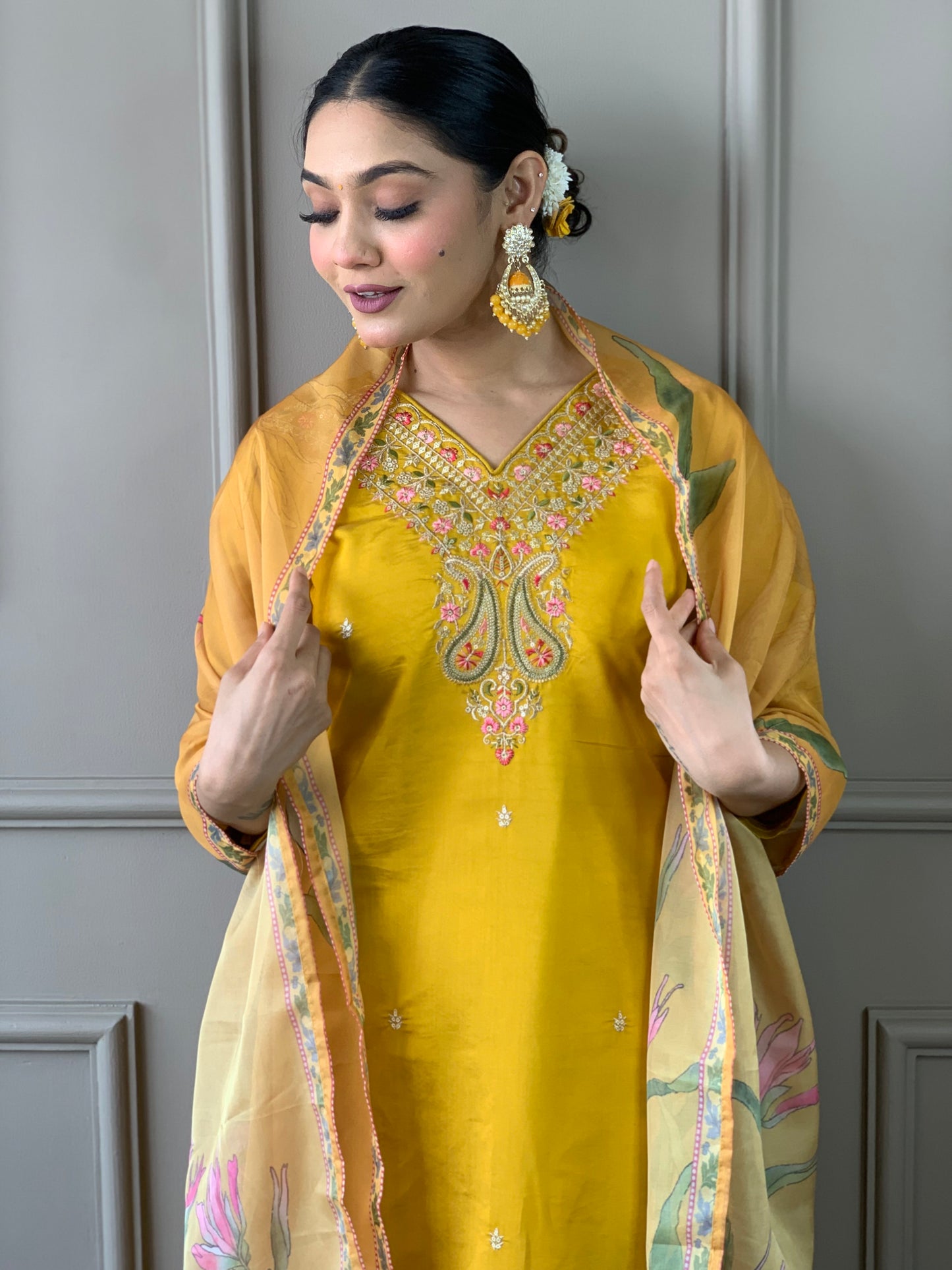 Elevate your style with this stunning mustard yellow kurti set, adorned with intricate embroidery and floral accents