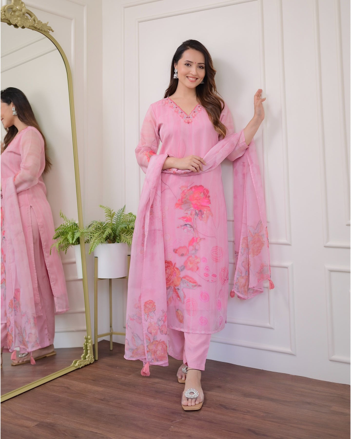 Embrace elegance with this gorgeous pink kurti set, featuring delicate embroidery and floral prints.