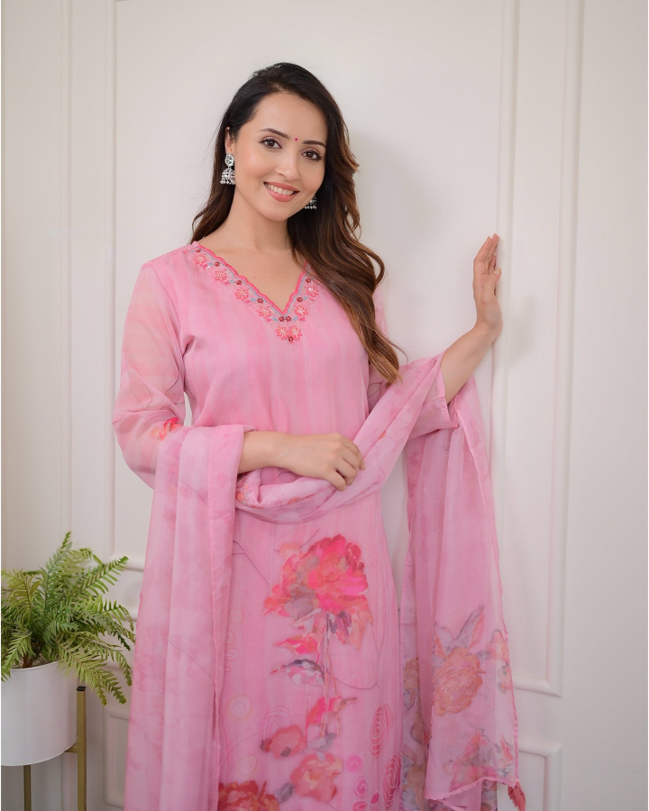 Embrace elegance with this gorgeous pink kurti set, featuring delicate embroidery and floral prints.