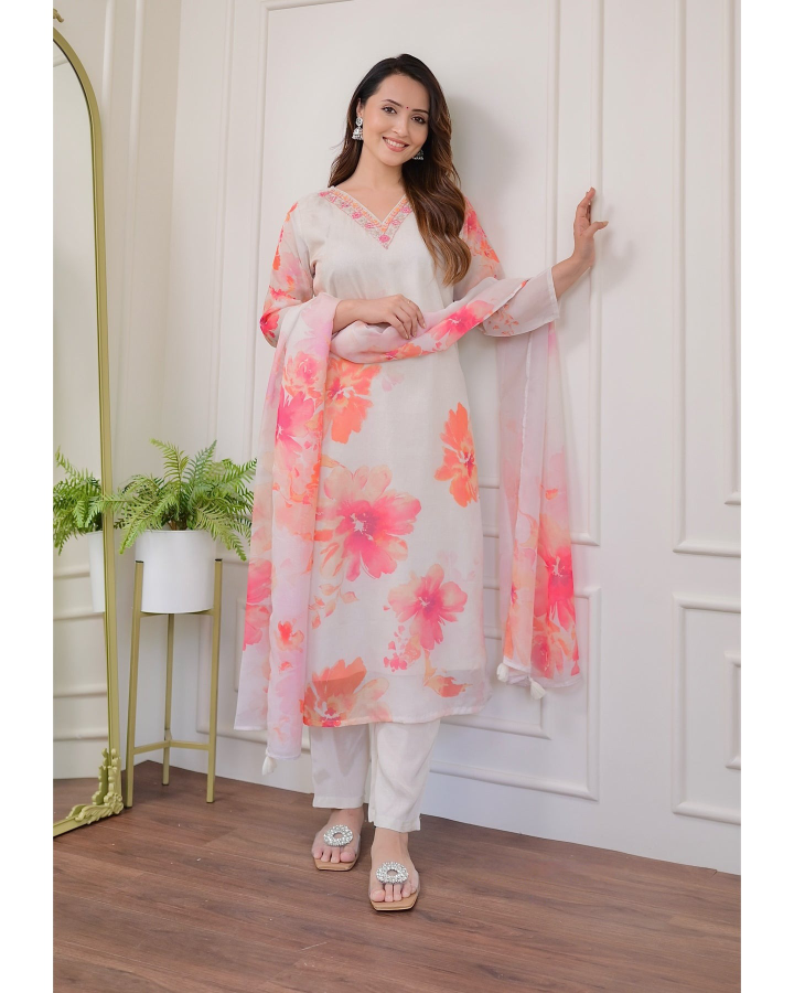 Embrace elegance with this gorgeous pink kurti set, featuring delicate embroidery and floral prints.