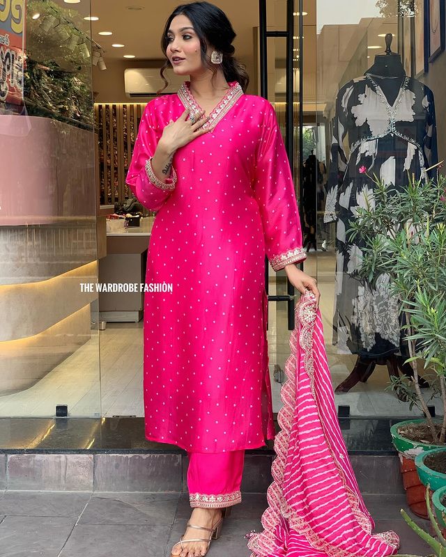 Step into timeless elegance with this vibrant pink kurti set, featuring intricate mirror work and a stunning bandhani dupatta