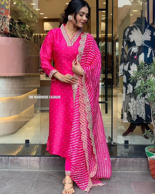 Step into timeless elegance with this vibrant pink kurti set, featuring intricate mirror work and a stunning bandhani dupatta