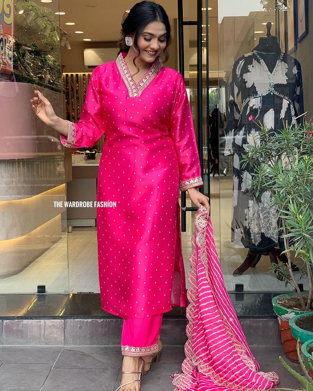 Step into timeless elegance with this vibrant pink kurti set, featuring intricate mirror work and a stunning bandhani dupatta
