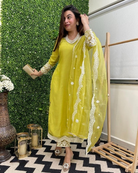 Step into timeless elegance with this vibrant green kurti set, featuring intricate mirror work and a stunning bandhani dupatta