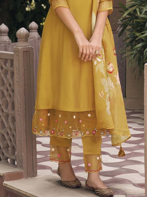 Embrace elegance with this enchanting green kurti set, adorned with delicate floral embroidery and a flowy printed dupatta. The intricate details add a touch of sophistication, making it perfect for festive and casual wear