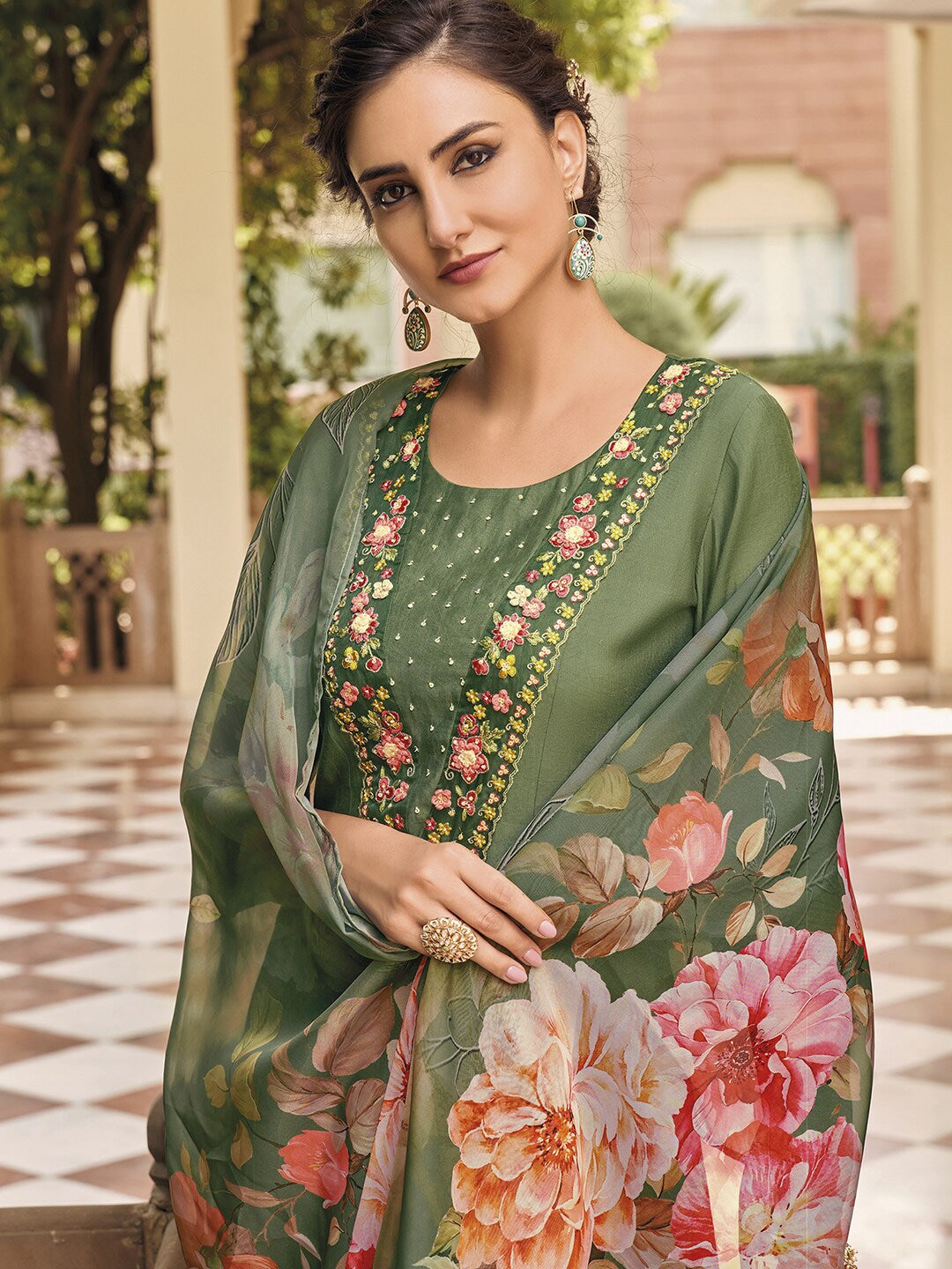 Embrace elegance with this enchanting green kurti set, adorned with delicate floral embroidery and a flowy printed dupatta. The intricate details add a touch of sophistication, making it perfect for festive and casual wear