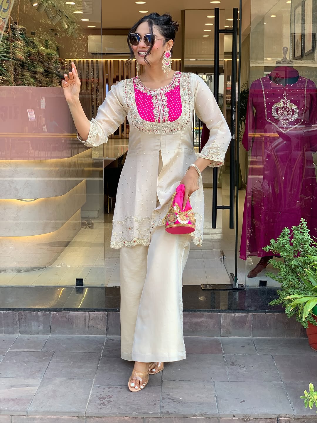 Elevate your ethnic style with this elegant cream kurti set featuring intricate embroidery and a striking purple yoke. Paired with flared pants, this outfit blends tradition with modern flair—perfect for festive occasions or graceful daywear.
