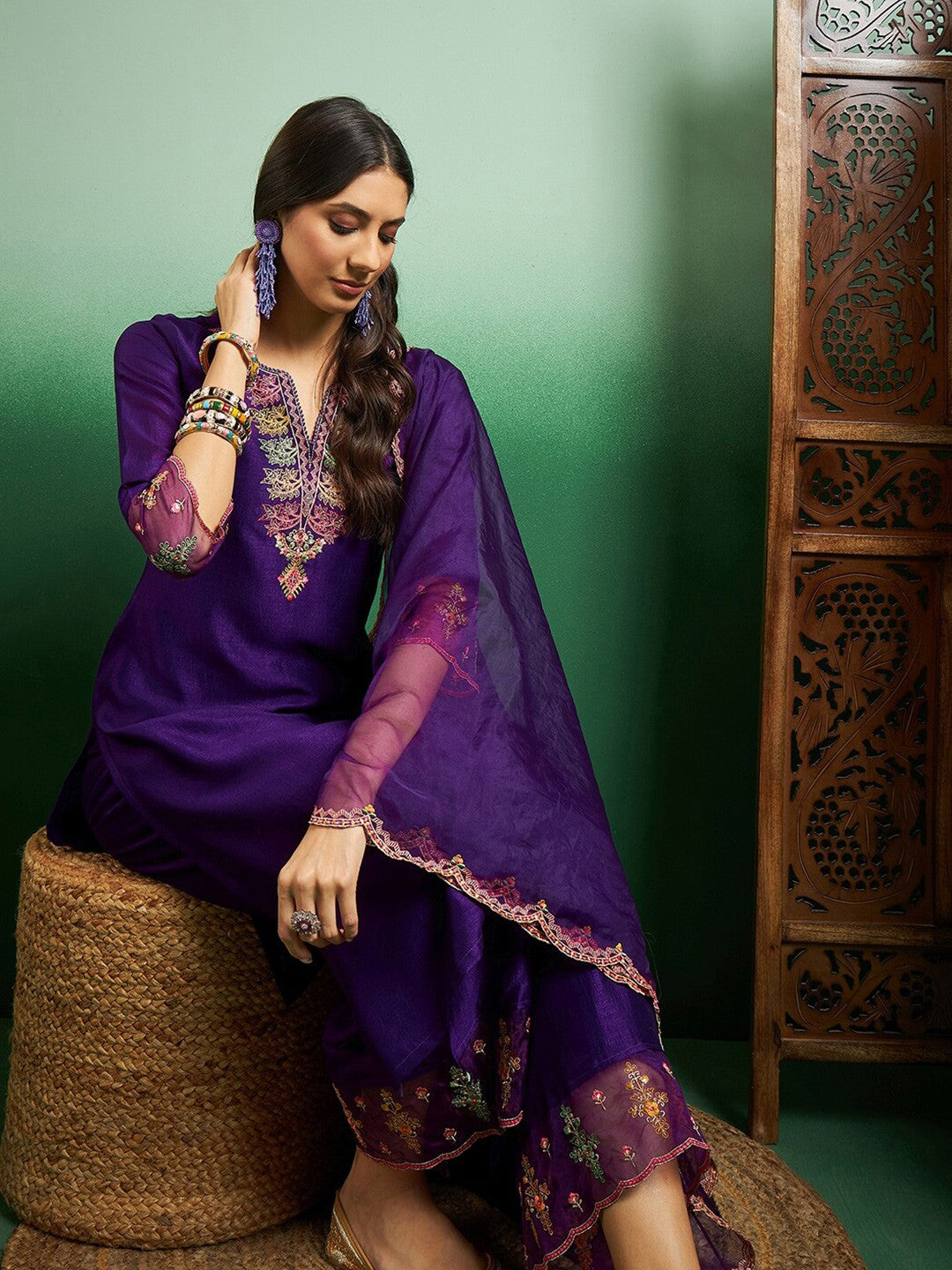 Elevate your style with this regal purple kurti set, adorned with intricate embroidery and delicate scalloped detailing
